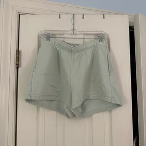 Aritzia TNA cozy boyfriend fleece - sage green shorts